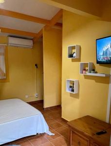 Postel nebo postele na pokoji v ubytování La Ruche - Bungalow avec vue mer