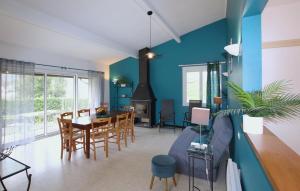 a dining room and living room with a table and chairs at Nice Home In Bourdeaux With Kitchen in Bourdeaux