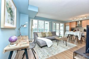 a living room with a couch and a table at 300 Front Suites in Toronto