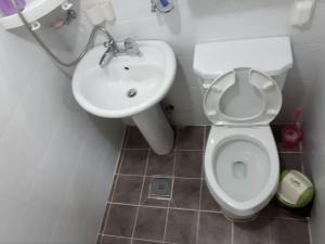 a bathroom with a toilet and a sink at Ilsan Beach Daewangam Park Property in Ulsan