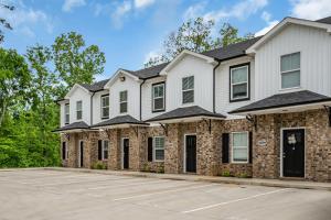 a house with a driveway in front of it at Tee Time Treasures in Sango (1625 Gold Club Ln, #602) in Clarksville