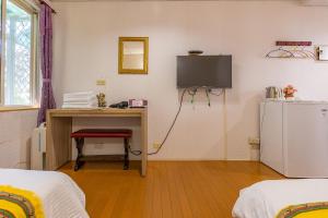 Voodi või voodid majutusasutuse Yishin Garden B&B toas
