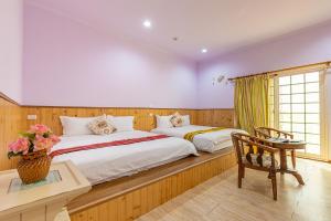 Voodi või voodid majutusasutuse Yishin Garden B&B toas