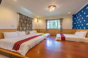 Voodi või voodid majutusasutuse Yishin Garden B&B toas