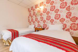 Voodi või voodid majutusasutuse Yishin Garden B&B toas