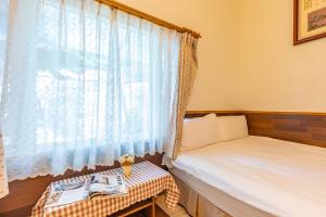 Voodi või voodid majutusasutuse Yishin Garden B&B toas