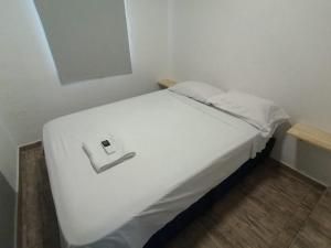 Ένα ή περισσότερα κρεβάτια σε δωμάτιο στο Casa de vacaciones Santa Marta!