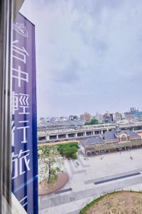 a view of a city from a building with a sign at Hotel Leisure 台中輕行旅 in Taichung