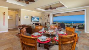 a dining room with a table and chairs at Beautiful Ocean Villa Beautiful Mauna Kea Home with Sunsets and Ocean Views in Hapuna Beach