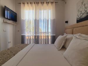Säng eller sängar i ett rum på Villa JOSANA