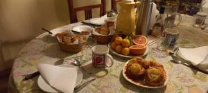 a table with a plate of food on a table at Mi habitación en Salta cerca de todo ! in Salta