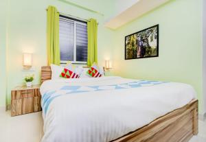 מיטה או מיטות בחדר ב-OYO Dhage's Homestay