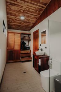 a bathroom with a toilet and a sink at Sereno Vista in Santa Cruz