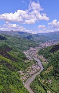 an aerial view of a river in a valley at Тушер in Rakhiv