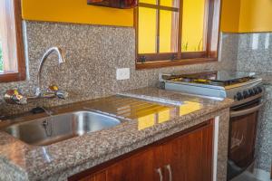 Kjøkken eller kjøkkenkrok på Hospedaje Cabaña Familiar