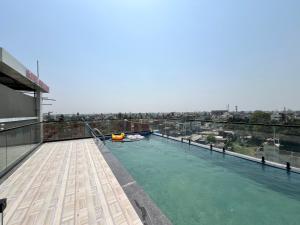 a swimming pool on the roof of a building at HOTEL PRAJYOT in Pūrnia