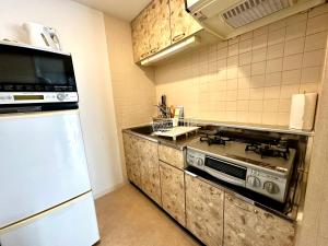 Nhà bếp/bếp nhỏ tại 札幌駅北口から徒歩圏内で好立地最大4名滞在可能な広い室内空間