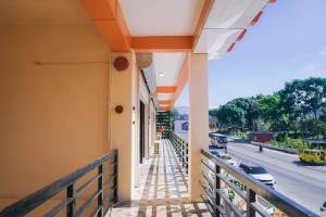 a balcony of a building with a view of a street at Lina Suites Deluxe Room in Malaybalay