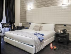 A bed or beds in a room at Navona Living Rome