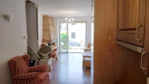 a hallway with a living room and a dining room at lago dorato in Dervio +19 photos