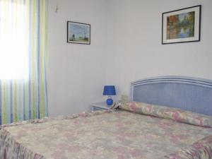 Łóżko lub łóżka w pokoju w obiekcie Apartamentos Esmeralda Unitursa