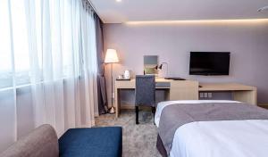 TV a/nebo společenská místnost v ubytování Hotel Shalom Jeju
