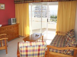 Telewizja i/lub zestaw kina domowego w obiekcie Apartamentos Esmeralda Unitursa
