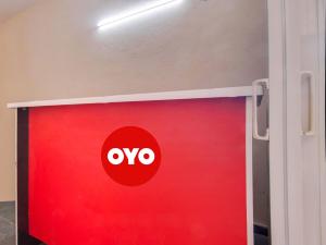 a red door with the ovo logo on it at G7 Residency in Pargi