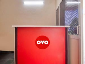a red object with the ovo logo on it at G7 Residency in Pargi