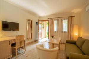 a living room with a couch and a table at Dalyan Resort - Special Category in Dalyan