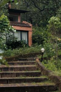 a set of stairs in front of a house at Sai Vishram Beach Resort in Baindūru