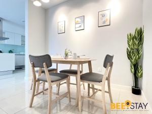 a dining room table and chairs in a kitchen at Sentral Suite KL Sentral City View 6PAX in Kuala Lumpur