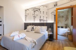 Postel nebo postele na pokoji v ubytování Hotel Mia Cara & Spa