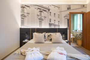 Postel nebo postele na pokoji v ubytování Hotel Mia Cara & Spa