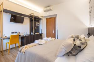 Postel nebo postele na pokoji v ubytování Hotel Mia Cara & Spa