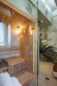a sauna with a glass shower in a room at Hotel Mia Cara & Spa in Florence