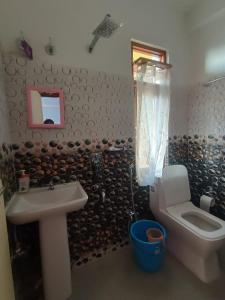 a bathroom with a sink and a toilet at Barbet Homestay Kitam in Namchi
