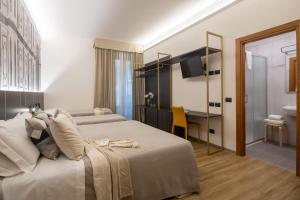 Postel nebo postele na pokoji v ubytování Hotel Mia Cara & Spa