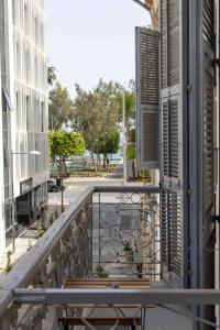 a balcony with a view of a street at Limassol Old Town Mansion in Limassol
