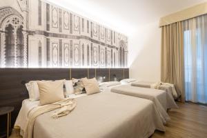 Postel nebo postele na pokoji v ubytování Hotel Mia Cara & Spa