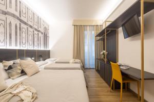 Postel nebo postele na pokoji v ubytování Hotel Mia Cara & Spa