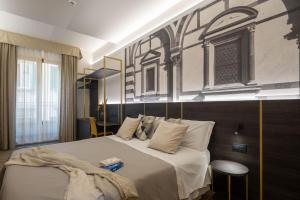 Postel nebo postele na pokoji v ubytování Hotel Mia Cara & Spa