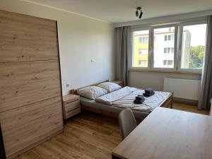 Posteľ alebo postele v izbe v ubytovaní Baltic and Forest Apartament