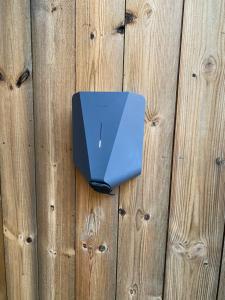 a blue object is hanging on a wooden fence at Paradis på Sørlandet in Kristiansand