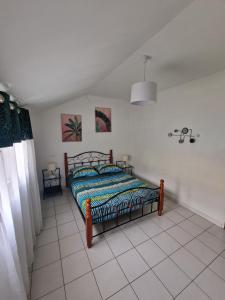 Postel nebo postele na pokoji v ubytování Maison du piton st leu, vue mer