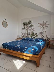 Postel nebo postele na pokoji v ubytování Maison du piton st leu, vue mer