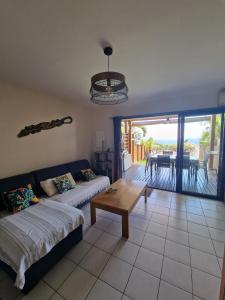 Postel nebo postele na pokoji v ubytování Maison du piton st leu, vue mer