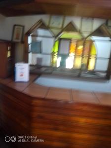 a blurry picture of a building with stained glass windows at Ruby's Guesthouse Chigumula in Blantyre