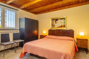 Posteľ alebo postele v izbe v ubytovaní Tuccios villa + 22 fotografií