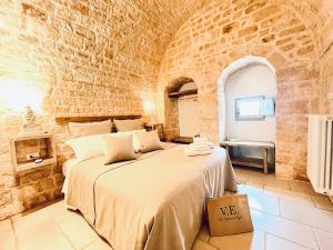Posteľ alebo postele v izbe v ubytovaní Trulli Lamascrasciola